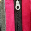 twist_softshell_gris_coton_rose_detail_curseur_dessus_ferme